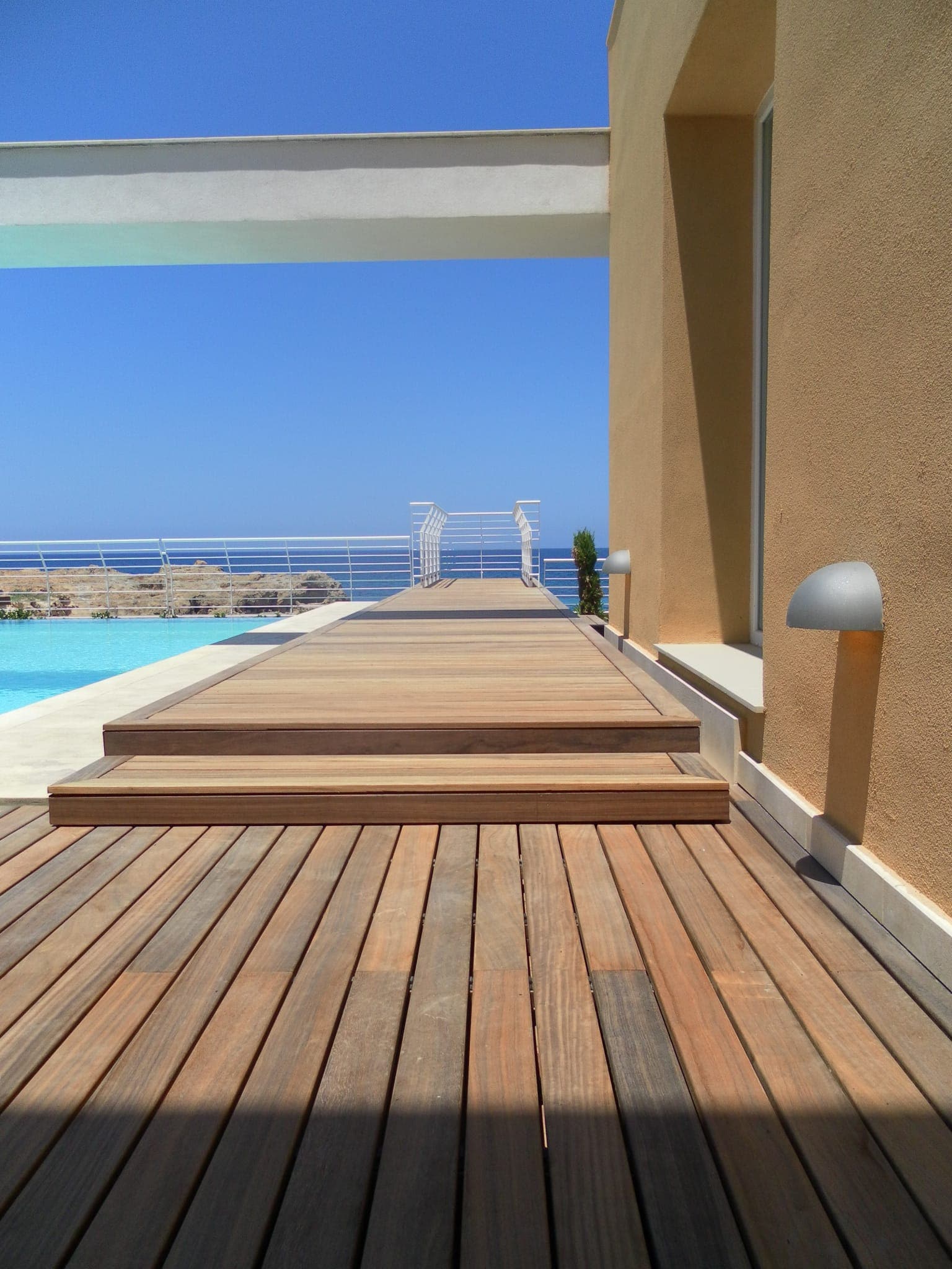 Nice pool in Malta full of wood padauk decking system by Vetedy Softline without screws