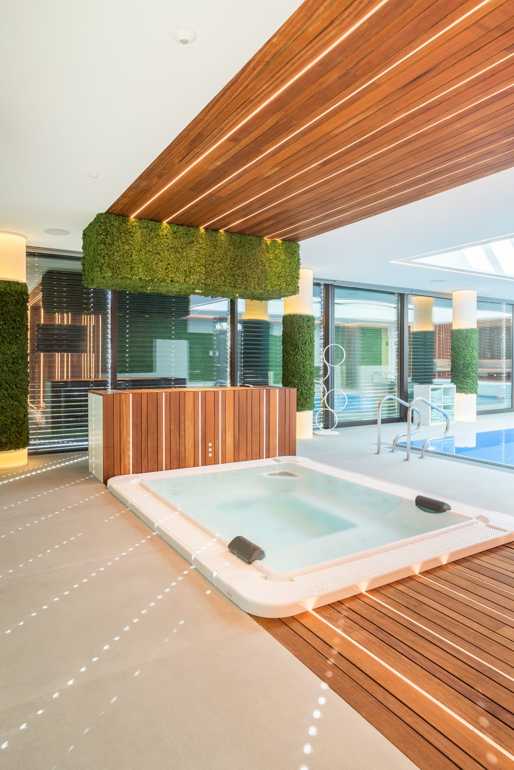 Incredible wood cladding jacuzzi in a luxury house in Romania made by Floors4You with leds by Vetedy Techniclic padauk invisible fixations systems